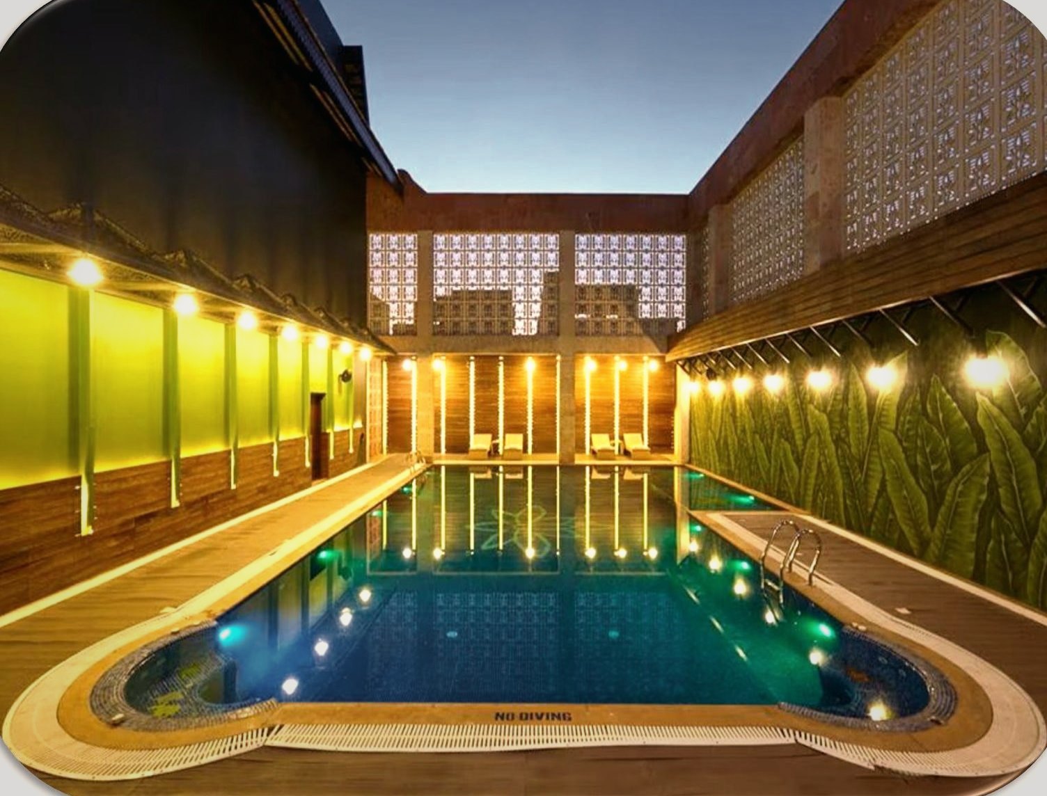 Club Anandam — poolside at dusk