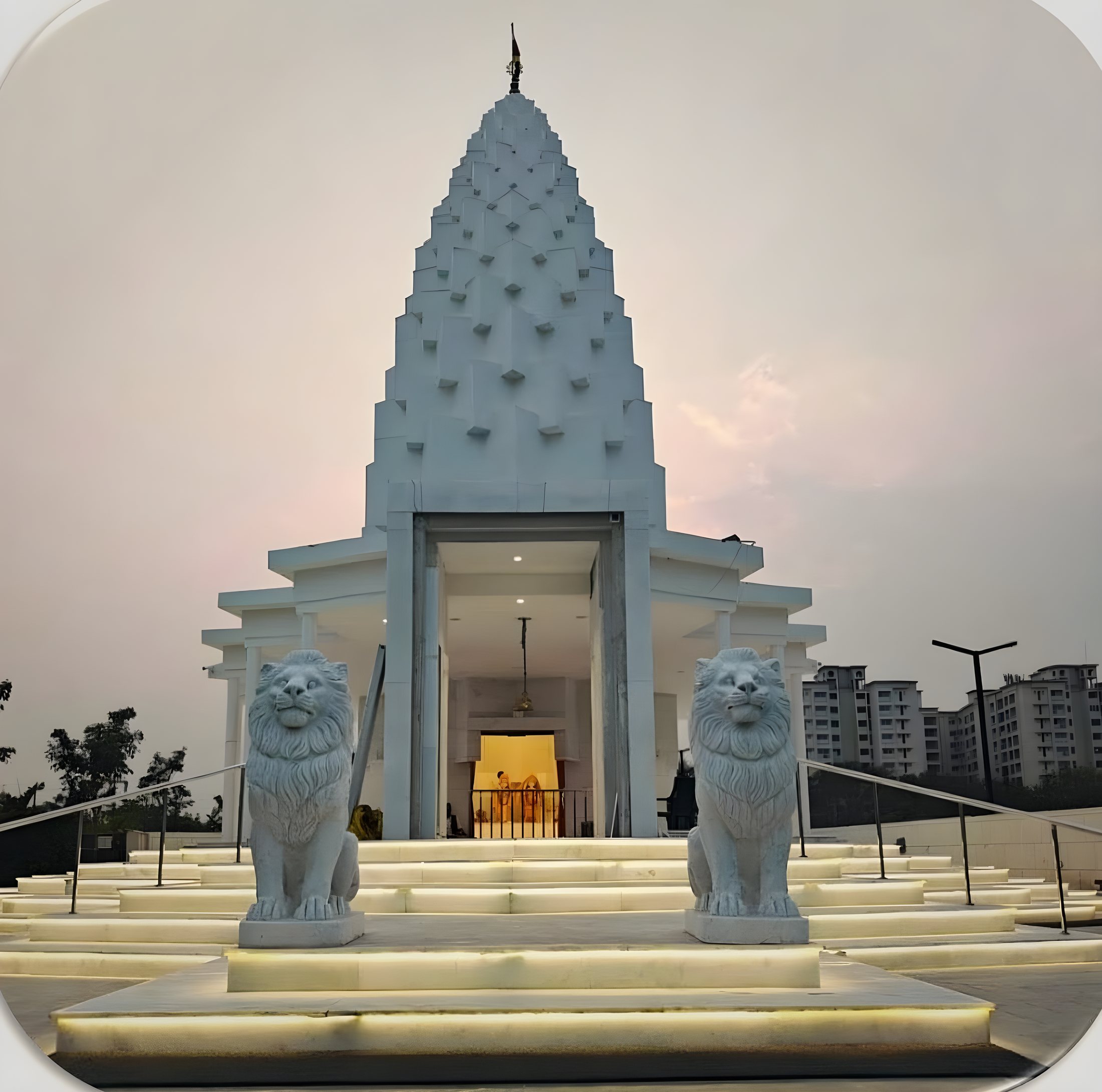 Shridham Radha Krishna Temple illuminated at dusk